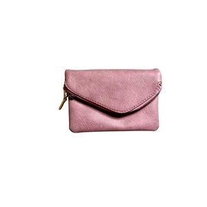 Mini rose colored faux leather clutch with strap holders to use as a crossbody.